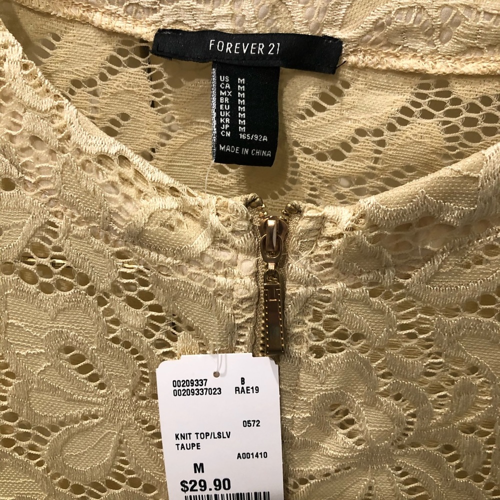 Peplum zip front top